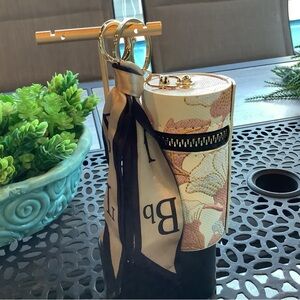 NWT, bag charm with storage and ribbon.